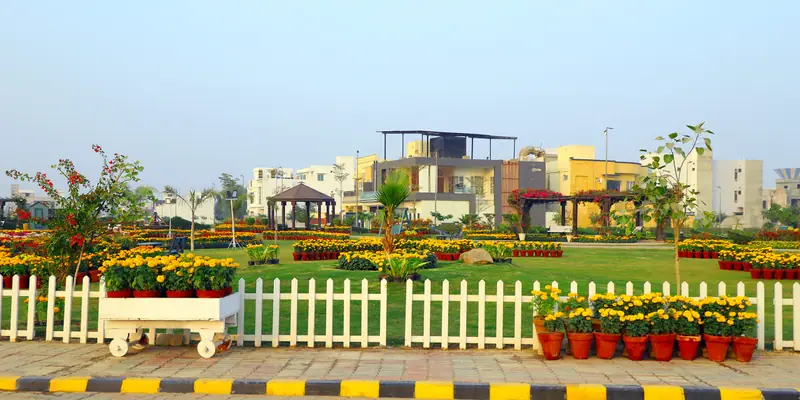 Green park with family homes in a Multan housing society